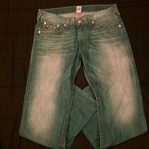True religion straight fit jeans, Blue jeans and back pockets are red, Size 38
